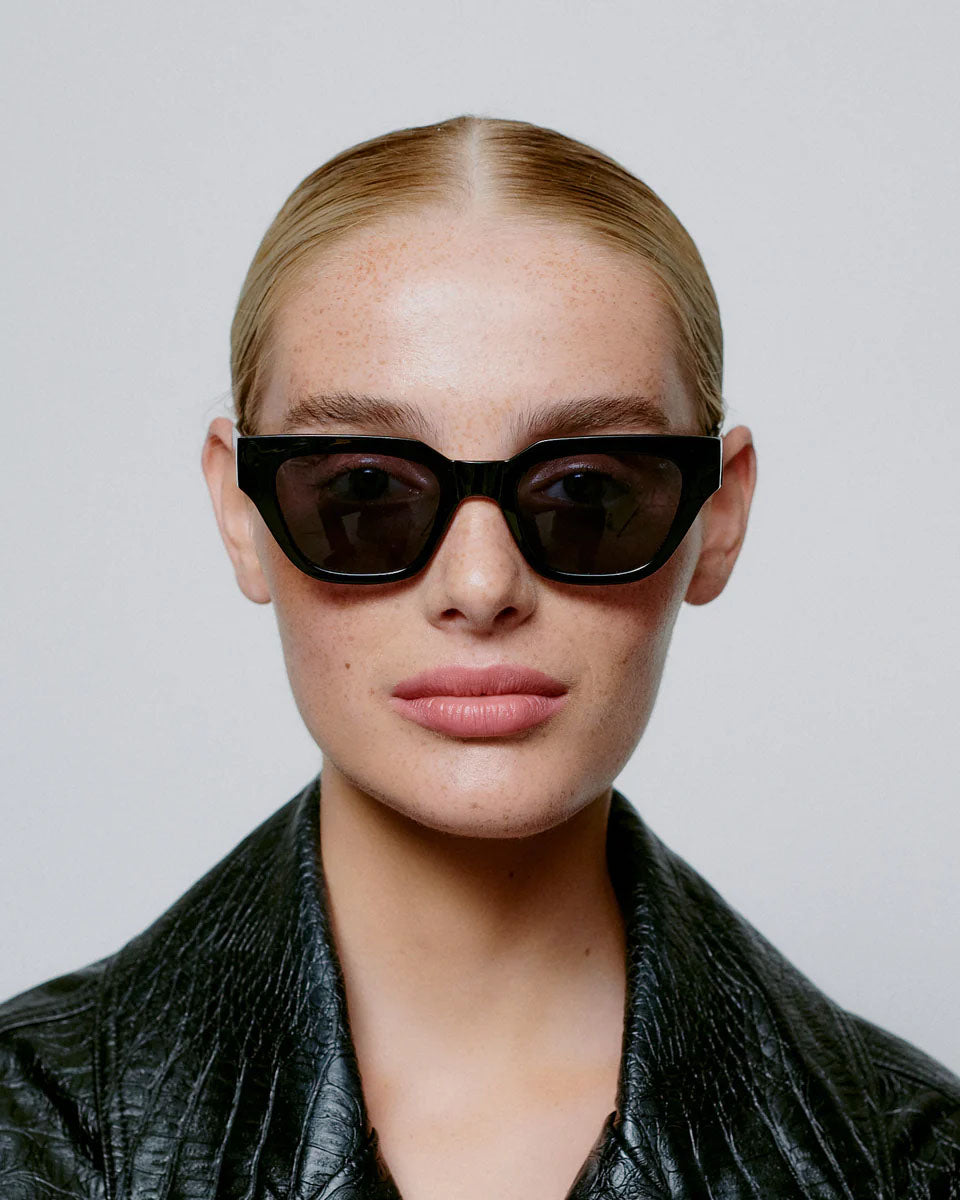 A. KJAERBEDE Kaws black sunglasses