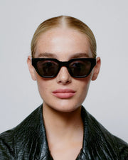 A. KJAERBEDE Kaws black sunglasses
