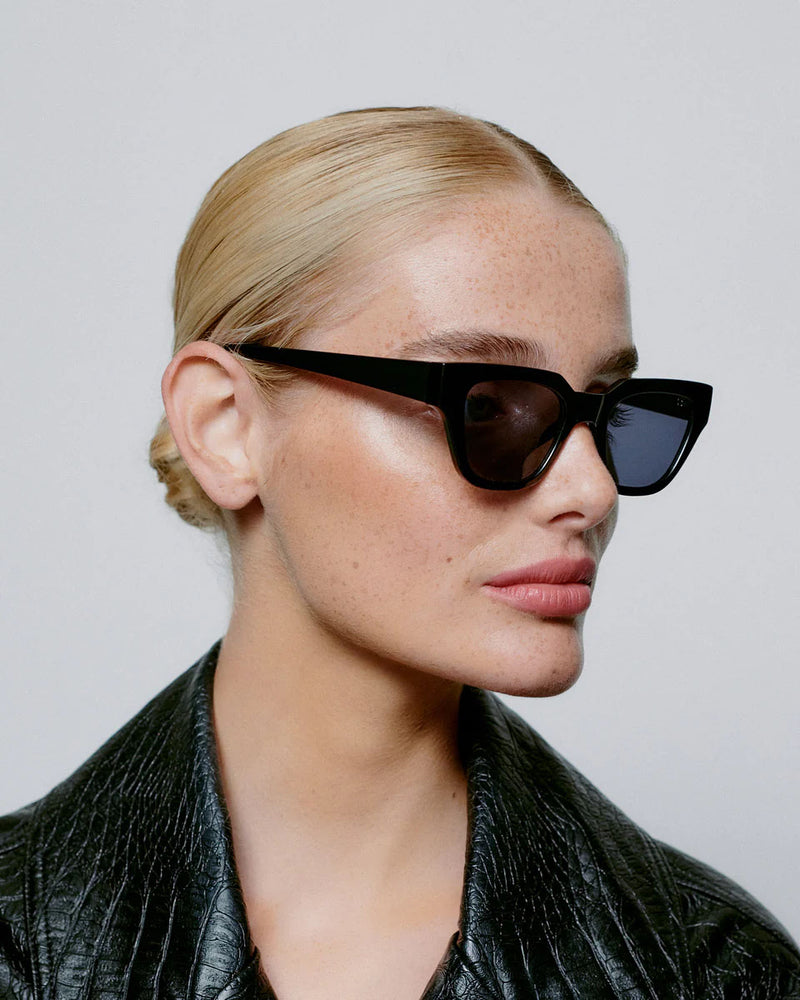 A. KJAERBEDE Kaws black sunglasses