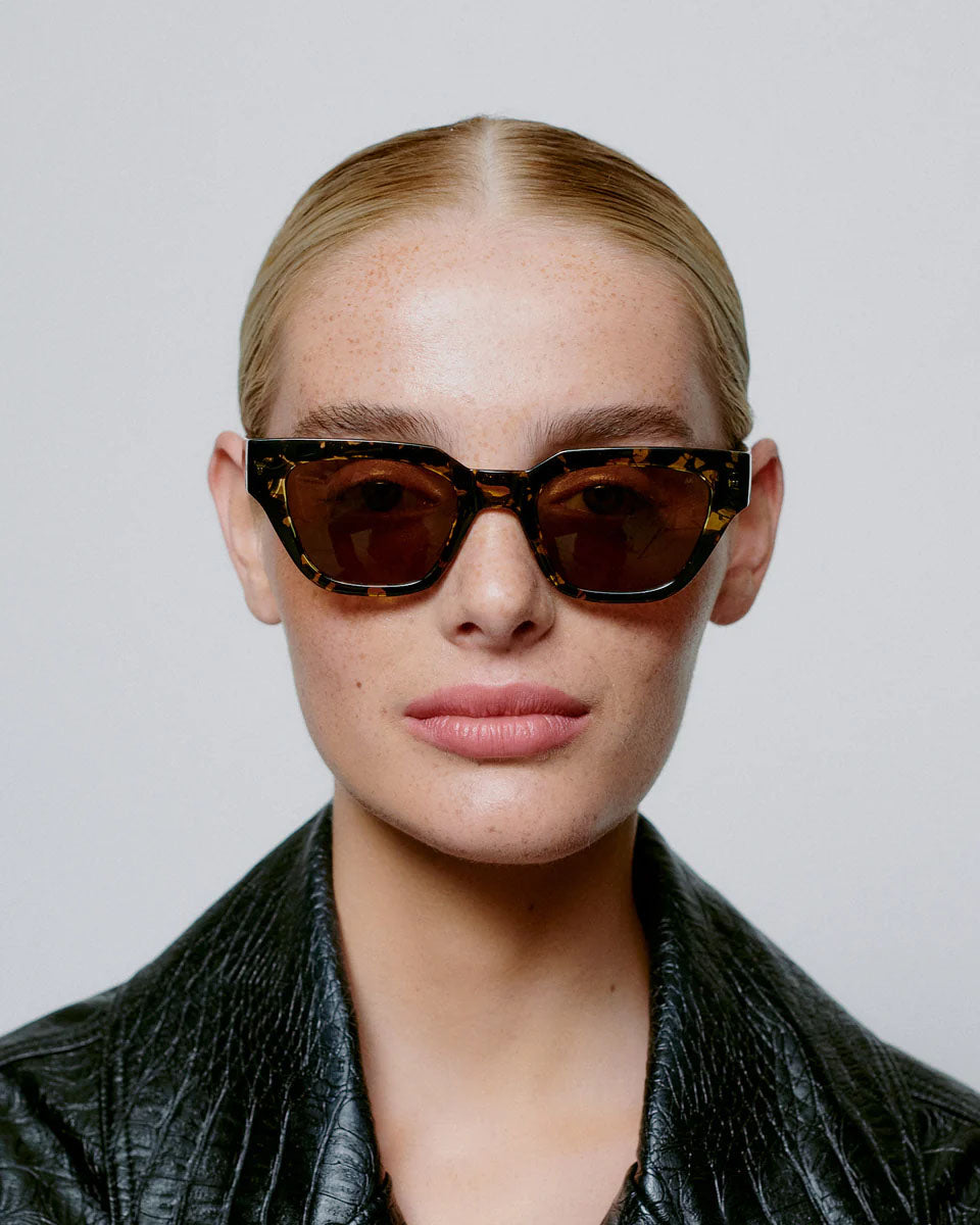A. KJAERBEDE Kaws black yellow sunglasses