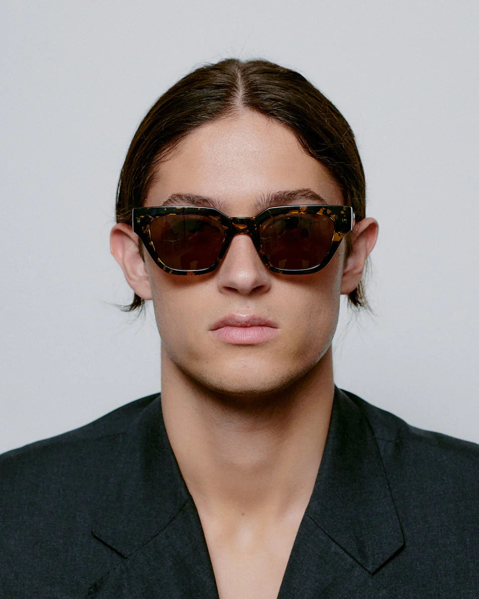 A. KJAERBEDE Kaws black yellow sunglasses
