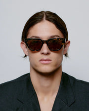 A. KJAERBEDE Kaws black yellow sunglasses