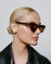 A. KJAERBEDE Kaws black yellow sunglasses