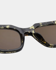 A. KJAERBEDE Kaws black yellow sunglasses