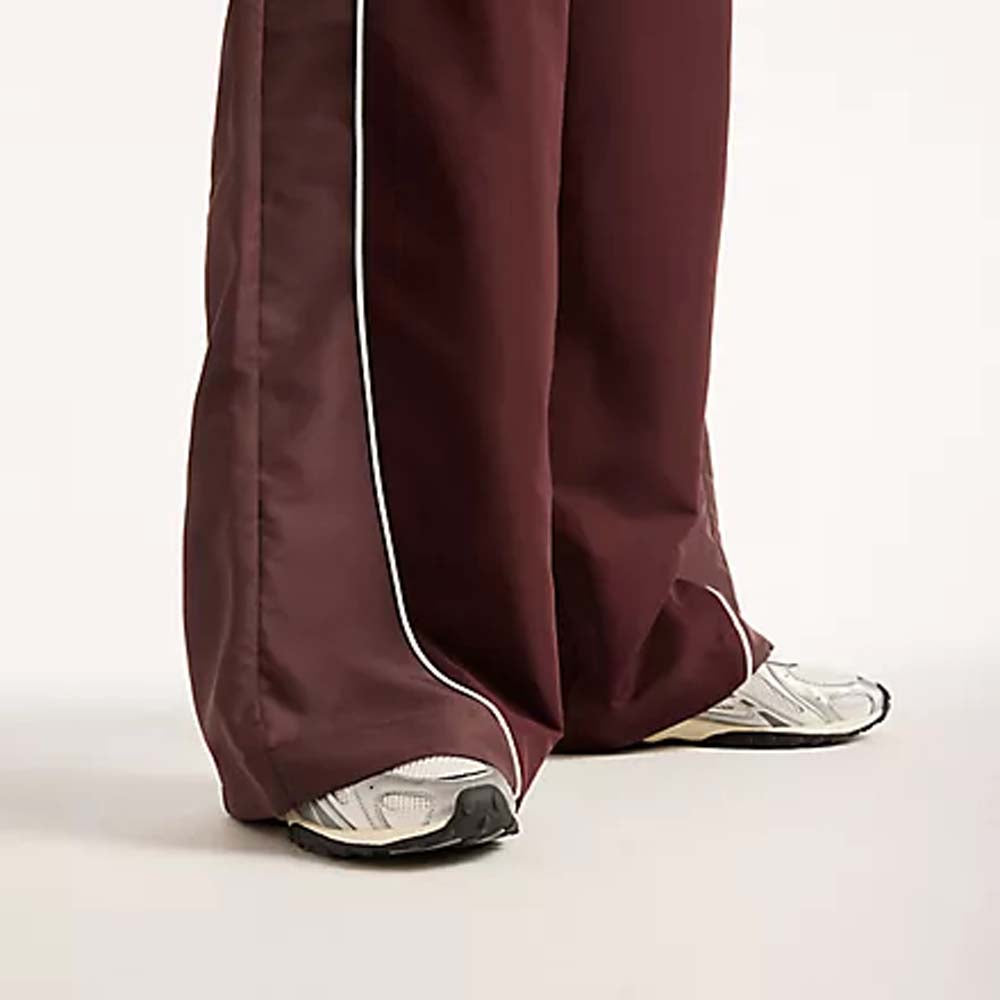 NEW BALANCE Trackside woven pant cherry leather