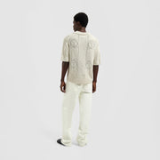 OLAF HUSSEIN Face logo knit polo off white